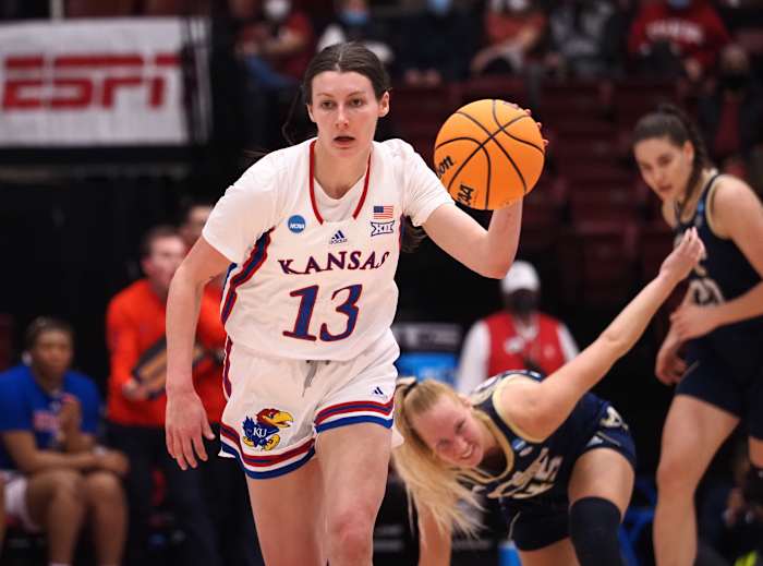 Mar 18, 2022; Stanford, California, USA; Kansas Jayhawks guard Holly Kersgieter (13) on a fast break after stealing the ball against Georgia Tech Yellow Jackets forward Digna Strautmane (45) during the second quarter at Maples Pavilion. Mandatory Credit: Kelley L Cox-USA TODAY Sports